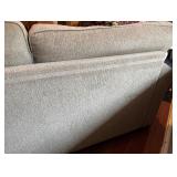 SR - Grey Upholstered Couch with Floral and Green Throw Pillows