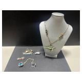 Collection of Nautical Brooches, Shell Clip, and Dolphin Necklace