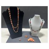 Collection of Vintage Coral Jewelry Including Necklaces, Rings, and Brooches