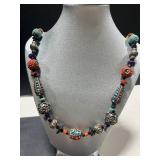 Collection of Vintage Coral Jewelry Including Necklaces, Rings, and Brooches