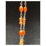 Collection of Vintage Coral Jewelry Including Necklaces, Rings, and Brooches