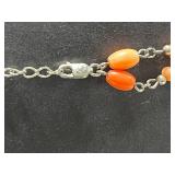 Collection of Vintage Coral Jewelry Including Necklaces, Rings, and Brooches