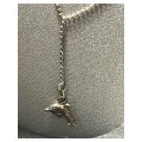 Collection of Sterling Silver Jewelry Including Dolphin Necklace, Anchor Pendants, and Cuff Bracelet