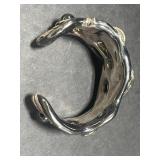 Collection of Sterling Silver Jewelry Including Dolphin Necklace, Anchor Pendants, and Cuff Bracelet