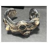 Collection of Sterling Silver Jewelry Including Dolphin Necklace, Anchor Pendants, and Cuff Bracelet