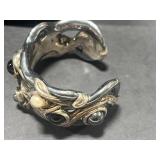 Collection of Sterling Silver Jewelry Including Dolphin Necklace, Anchor Pendants, and Cuff Bracelet