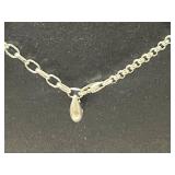 Collection of Sterling Silver Jewelry Including Dolphin Necklace, Anchor Pendants, and Cuff Bracelet