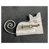 Collection of Costume Brooches Including Cat, Lion, Bird, Sailboat, Nautical Wheel, and Abstract Designs