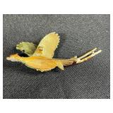 Collection of Costume Brooches Including Cat, Lion, Bird, Sailboat, Nautical Wheel, and Abstract Designs