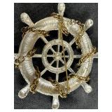 Collection of Costume Brooches Including Cat, Lion, Bird, Sailboat, Nautical Wheel, and Abstract Designs