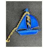 Collection of Costume Brooches Including Cat, Lion, Bird, Sailboat, Nautical Wheel, and Abstract Designs