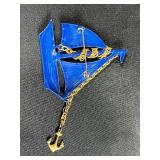 Collection of Costume Brooches Including Cat, Lion, Bird, Sailboat, Nautical Wheel, and Abstract Designs