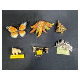 Collection of Vintage Costume Jewelry Brooches Including Trifari, Avon, and Ralph Massey