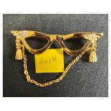 Collection of Vintage Costume Jewelry Brooches Including Trifari, Avon, and Ralph Massey