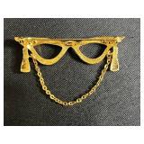 Collection of Vintage Costume Jewelry Brooches Including Trifari, Avon, and Ralph Massey