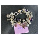 Sterling Silver Jewelry Collection with Necklaces, Bracelets, and Dark Gray Stone Ring