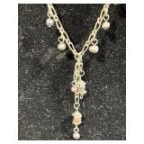 Sterling Silver Jewelry Collection with Necklaces, Bracelets, and Dark Gray Stone Ring