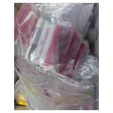 Collection of Plastic Bags and Round Paper Tags with String