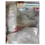 Collection of Plastic Bags and Round Paper Tags with String