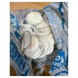 Collection of Plastic Bags and Round Paper Tags with String