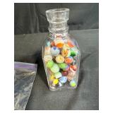 Collection of Vintage Marbles in Glass Bottle and Bag with 2 Pez Dispensers