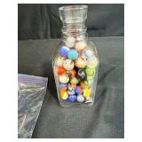 Collection of Vintage Marbles in Glass Bottle and Bag with 2 Pez Dispensers