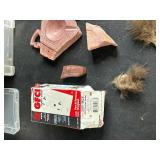 Mixed Lot of Vintage License Plates, Stone Carvings, and Miscellaneous Items in Storage Bins