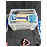 Mixed Lot of Vintage License Plates, Stone Carvings, and Miscellaneous Items in Storage Bins