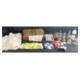 Antique Lot with Oil Lamps, Textiles, Suitcase, and Encyclopedia