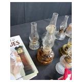 Antique Lot with Oil Lamps, Textiles, Suitcase, and Encyclopedia