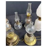 Antique Lot with Oil Lamps, Textiles, Suitcase, and Encyclopedia