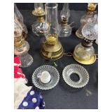 Antique Lot with Oil Lamps, Textiles, Suitcase, and Encyclopedia