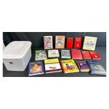 Collection of Cookbooks and Bartender Guides with Storage Bin