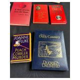 Collection of Cookbooks and Bartender Guides with Storage Bin