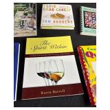 Collection of Cookbooks and Bartender Guides with Storage Bin