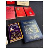 Collection of Cookbooks and Bartender Guides with Storage Bin