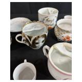 Collection of Antique and Vintage Porcelain Cups and Saucers with Handpainted Details