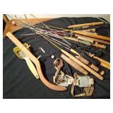 Bucket of ice fishing rods, cleats and more