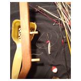 Bucket of ice fishing rods, cleats and more