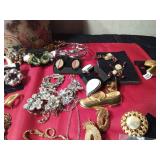 Tin of vintage jewelry and more