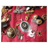 Tin of vintage jewelry and more