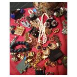 Tin of vintage jewelry and more