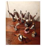 Ceramic and resin eagle figurines and 1 toucan
