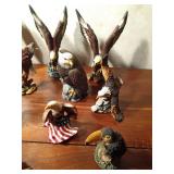 Ceramic and resin eagle figurines and 1 toucan