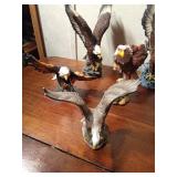 Ceramic and resin eagle figurines and 1 toucan