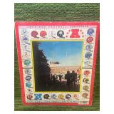 1983 Topps Football Sticker Album Half Full of stickers