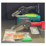 G - Pair of North Tech 4-Inch Pruning Chainsaws with Batteries, Charger, Extra Blade and Chains