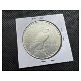 1922-D Peace Silver Dollar Marked AU When Purchased