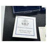 Five Coins: 1958 and 1959 Proof Jefferson Nickels; 1999 Proof Susan B. Anthony Dollar in U. S. Mint Package with COA; Two 1986-D Uncirculated Half Dollars