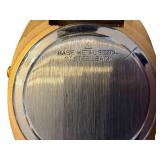 Vintage Digital Watch with Gold-Tone Bezel and Stainless Steel Back